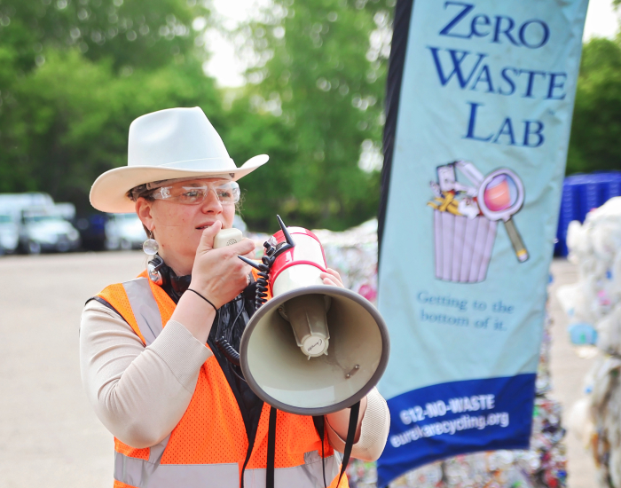 man speaking into bullhorn